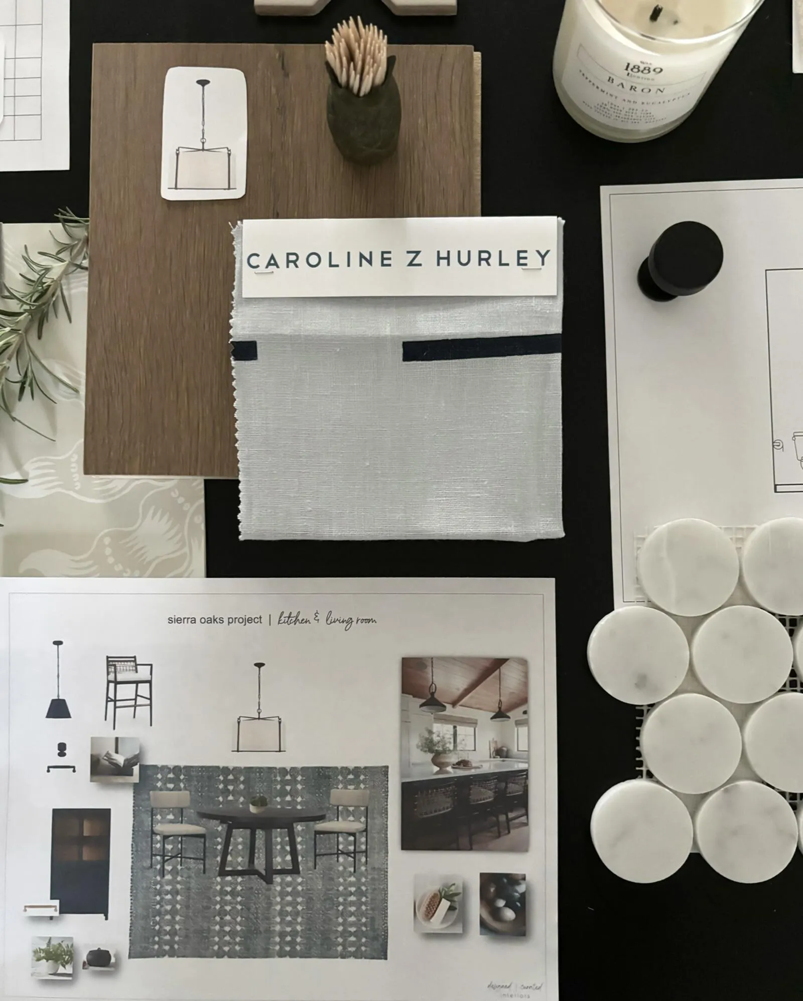 A flat lay of interior design materials and plans including fabric swatches, wood samples, a candle, tile samples, and a — Living Through a Remodel in Atherton - An Interior Designers Perspective