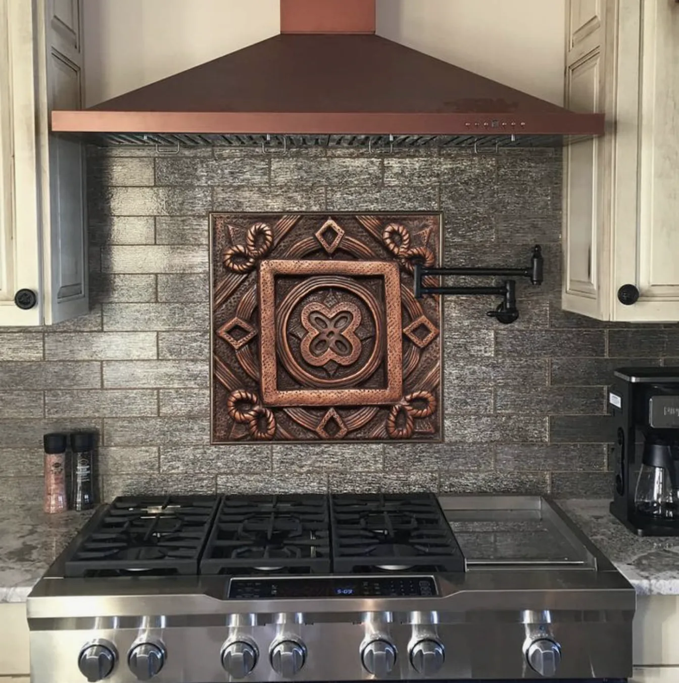 White shaker cabinetry and a vent hood from a Designed | Curated East Sacramento kitchen remodel
