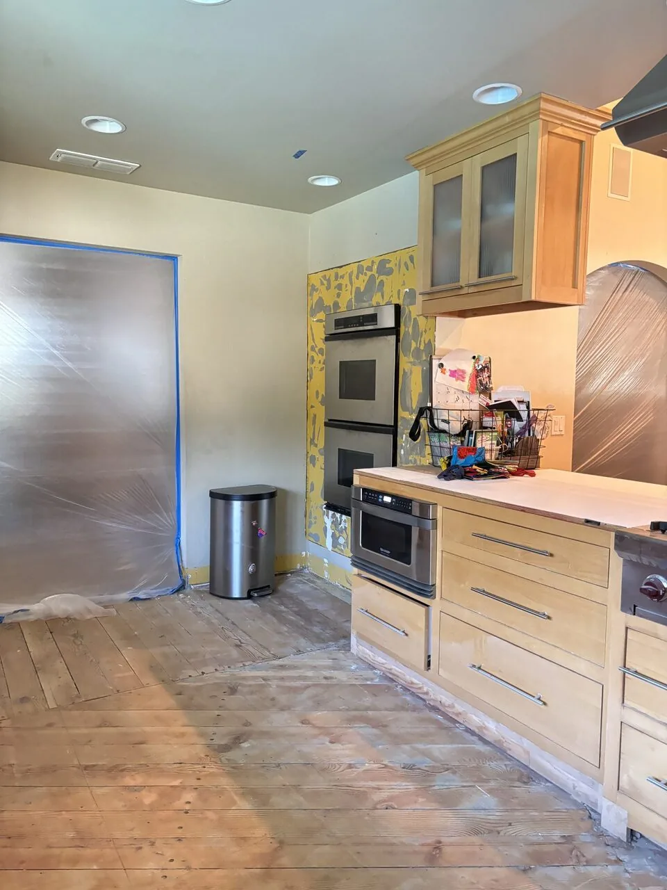 A galley kitchen with white cabinetry from a Designed | Curated East Sacramento remodel