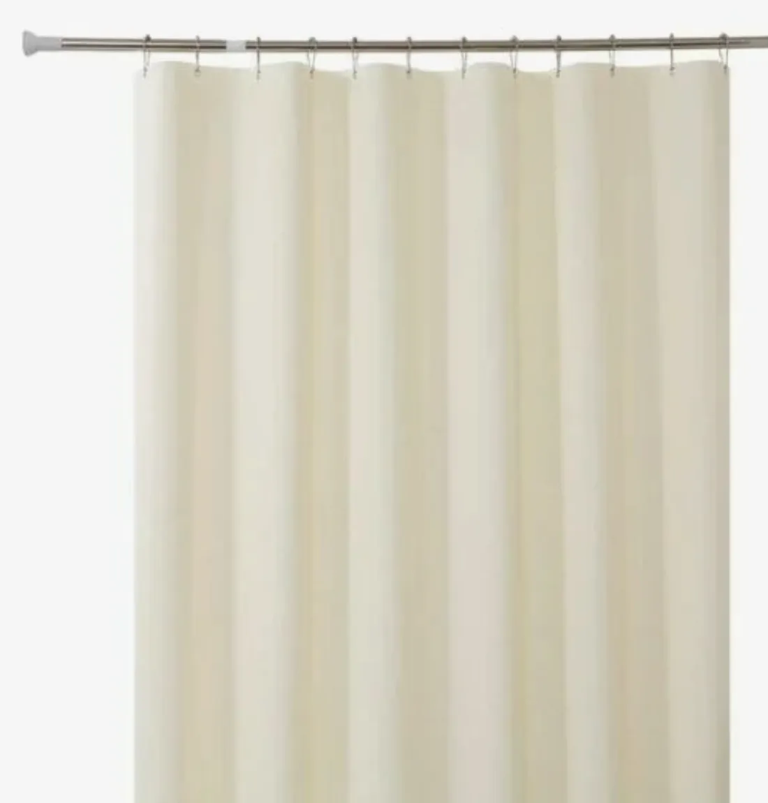 A bathroom vanity with a walk-in shower beyond